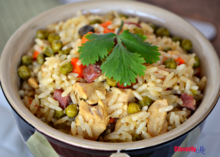 This Instant Pot Chicken and Rice (Arroz Con Pollo) is the perfect one-pot meal! All you need is chicken, hot dogs, rice, vegetables and a pressure cooker and you have the perfect meal anytime of the week. Find the recipe at CleverlyMe.com